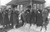 Дети освобожденного Гжатска (ныне — город Гагарин) показывают немецкие валенки